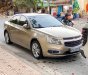 Chevrolet Cruze 2015 - Cần bán xe Chevrolet Cruze sản xuất năm 2015, màu vàng cát