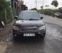 Ford Laser   2003 - Bán Ford Laser GHIA 1.8 MT sản xuất năm 2003, màu đen, 134 triệu