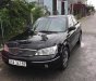 Ford Laser   2003 - Bán Ford Laser GHIA 1.8 MT sản xuất năm 2003, màu đen, 134 triệu