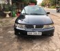 Mitsubishi Lancer GLXI 1.6 MT 2003 - Cần bán Mitsubishi Lancer GLXI 1.6 MT sản xuất 2003, màu xanh lam xe gia đình