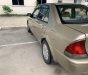 Ford Laser 2001 - Bán xe Ford Laser sản xuất năm 2001, màu vàng xe gia đình