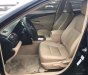 Toyota Camry 2014 - Cần bán gấp Toyota Camry 2.0E năm 2014, màu đen, 670tr