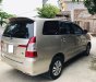 Toyota Innova 2.0E 2015 - Cần bán lại xe Toyota Innova 2.0E đời 2015, màu vàng, số sàn