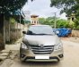 Toyota Innova 2.0E 2015 - Cần bán lại xe Toyota Innova 2.0E đời 2015, màu vàng, số sàn