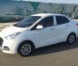 Hyundai Grand i10 2019 - Gia đình tôi cần bán Hyundai I10 2019, số sàn, màu trắng, sedan