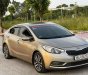 Kia K3   1.6 MT  2014 - Bán ô tô Kia K3 1.6 MT năm 2014, màu vàng cát, 350tr