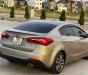 Kia K3   1.6 MT  2014 - Bán ô tô Kia K3 1.6 MT năm 2014, màu vàng cát, 350tr