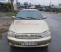 Kia Spectra   1.6 MT  2004 - Xe Kia Spectra 1.6 MT sản xuất năm 2004, màu vàng còn mới, 90 triệu