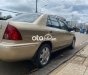 Ford Laser     2002 - Cần bán gấp Ford Laser đời 2002, màu vàng còn mới, giá 145tr