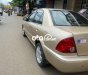 Ford Laser     2002 - Cần bán gấp Ford Laser đời 2002, màu vàng còn mới, giá 145tr