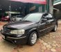 Ford Laser   1.8 Ghia  2005 - Cần bán Ford Laser 1.8 Ghia 2005, màu đen