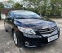 Toyota Corolla 1.8MT 2009 - Bán Toyota Corolla 1.8MT đời 2009, màu đen còn mới