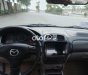 Mazda 323 2004 - Cần bán lại xe Mazda 323 sản xuất năm 2004, màu đen, giá 150tr