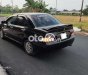 Mitsubishi Lancer 2003 - Cần bán xe Mitsubishi Lancer sản xuất năm 2003, màu đen còn mới giá cạnh tranh