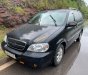 Kia Carnival   GS 2.5 AT  2009 - Cần bán Kia Carnival GS 2.5 AT năm sản xuất 2009, màu đen, 215 triệu