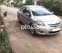 Toyota Vios E  2009 - Cần bán xe Toyota Vios E sản xuất năm 2009 màu ghi vàng, 215 triệu