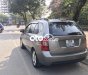 Kia Carens 2009 - Cần bán Kia Carens 2.0 MT đời 2009, màu xám còn mới