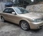 Ford Laser 2002 - Bán Ford Laser sản xuất 2002, màu vàng cát