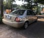 Ford Laser MT 2002 - Cần bán xe Ford Laser MT năm 2002, màu nâu