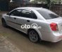 Daewoo Lacetti SE 2004 - Cần bán Daewoo Lacetti SE sản xuất năm 2004, màu bạc giá cạnh tranh