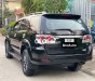 Toyota Fortuner G 2015 - Cần bán xe Toyota Fortuner G năm sản xuất 2015, màu đen số sàn, giá 642tr