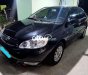 Toyota Corolla 1.8E MT 2004 - Cần bán Toyota Corolla 1.8E MT năm 2004, màu đen