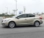 Kia K3 2014 - Cần bán gấp Kia K3 1.6AT sản xuất năm 2014, màu vàng cát, giá cạnh tranh