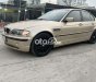 BMW 318i 2002 - Bán xe BMW 318i sản xuất năm 2002, màu vàng