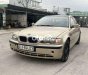 BMW 318i 2002 - Bán xe BMW 318i sản xuất năm 2002, màu vàng